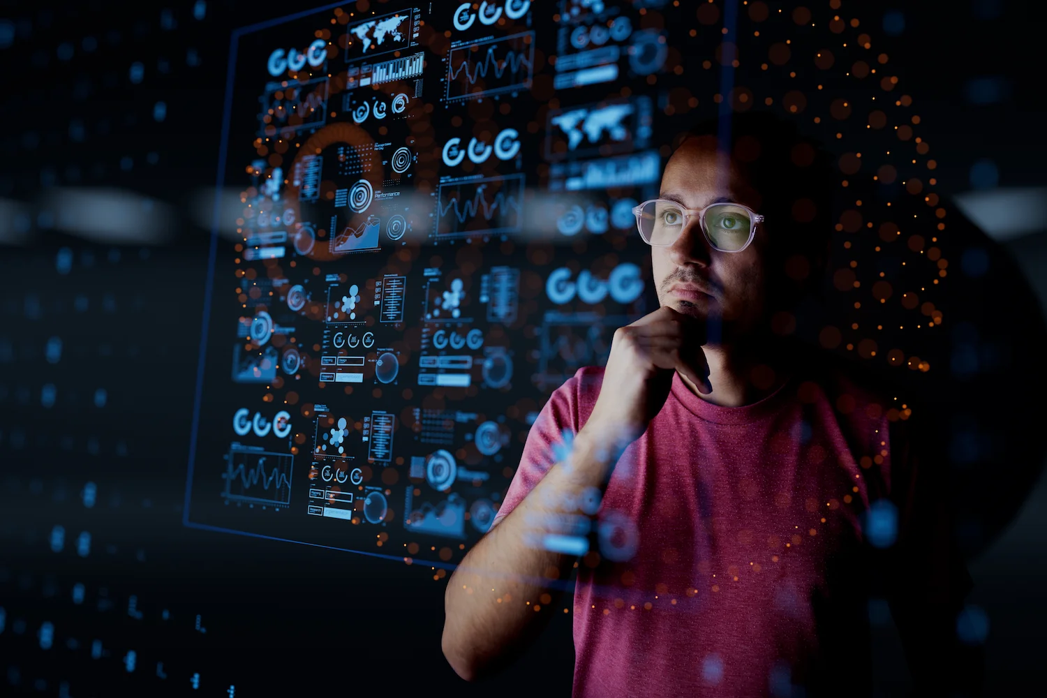 Man analyzing data on futuristic digital interface screen. Technology, data analysis, innovation concept.